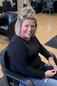 Courtney Potter sitting at hair designs